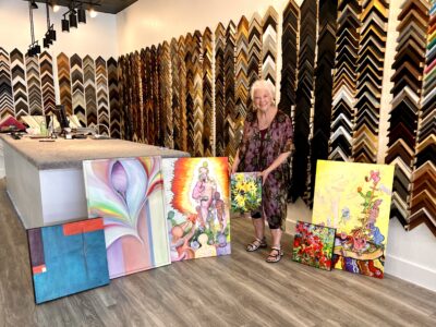 Mel Scott stands with some of her artwork, May 10, 2022, St. George, Utah, May 14, 2022 | Photo by Jessi Bang, St. George News