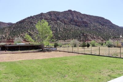 Views from the backyard of Rockmoore Retreats features grass and mountain views, Hildale, Utah, May 2, 2022 | Photo by Jessi Bang, St. George News