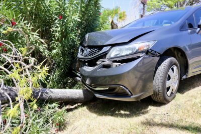 A Honda Civic that ran into a tree sits at the crash site on Dixie Drive, St. George, Utah, May 8, 2022 | Photo by Jessi Bang, St. George News