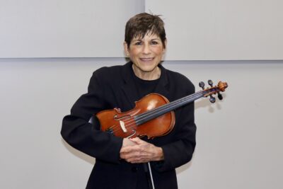 Linda DeLuca stands with the viola, Ivins, Utah, May 18, 2022 | Photo by Jessi Bang, St. George News