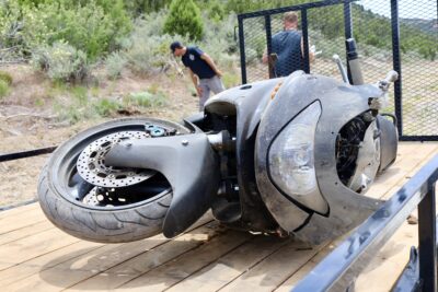 A motorcycle involved in a crash lays on a flatbed trailer ready to be hauled away from the scene, Central, Utah, May 22, 2022 | Photo by Jessi Bang, St. George News