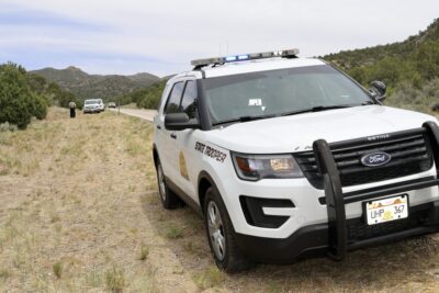 A Utah State Trooper vehicle is seen parked on the scene of a motorcycle crash, Central, Utah, May 22, 2022 | Photo by Jessi Bang, St. George News