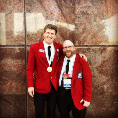 Kyler Kelsch stands with his teacher, Craig Milligan, during the Skills USA national screen printing technology competition, where he placed first, location and date unspecified | Photo courtesy of Kyler Kelsch, St. George News