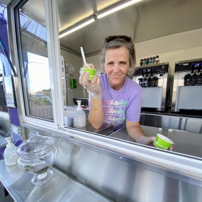 Mary Ludlow serves frozen yogurt at We Celebrate, location and date unspecified | Photo courtesy of Mary Ludlow, St. George News