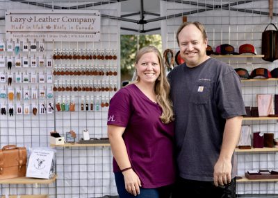 Lucy and Todd Duke, owners of Lazy 3 Leather Company, stand at one of their booths, location and date unspecified | Photo courtesy of Lucy and Todd Duke, St. George News