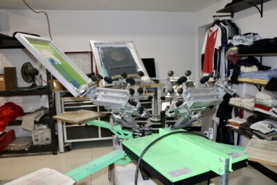 The inside of Geezy Tees features a smaller print machine, St. George, Utah, May 30 2022 | Photo by Jessi Bang, St. George News