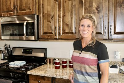 Shannon Brown stands in her kitchen next to her homemade jelly, Ivins, Utah, July 12, 2022 | Photo by Jessi Bang, St. George News