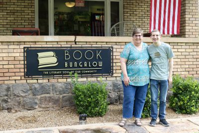 Tanya Mills stands in front of her bookstore with her son Jason Mills, a big inspiration behind the store opening, St. George, Utah, July 27, 2022 | Photo by Jessi Bang, St. George News