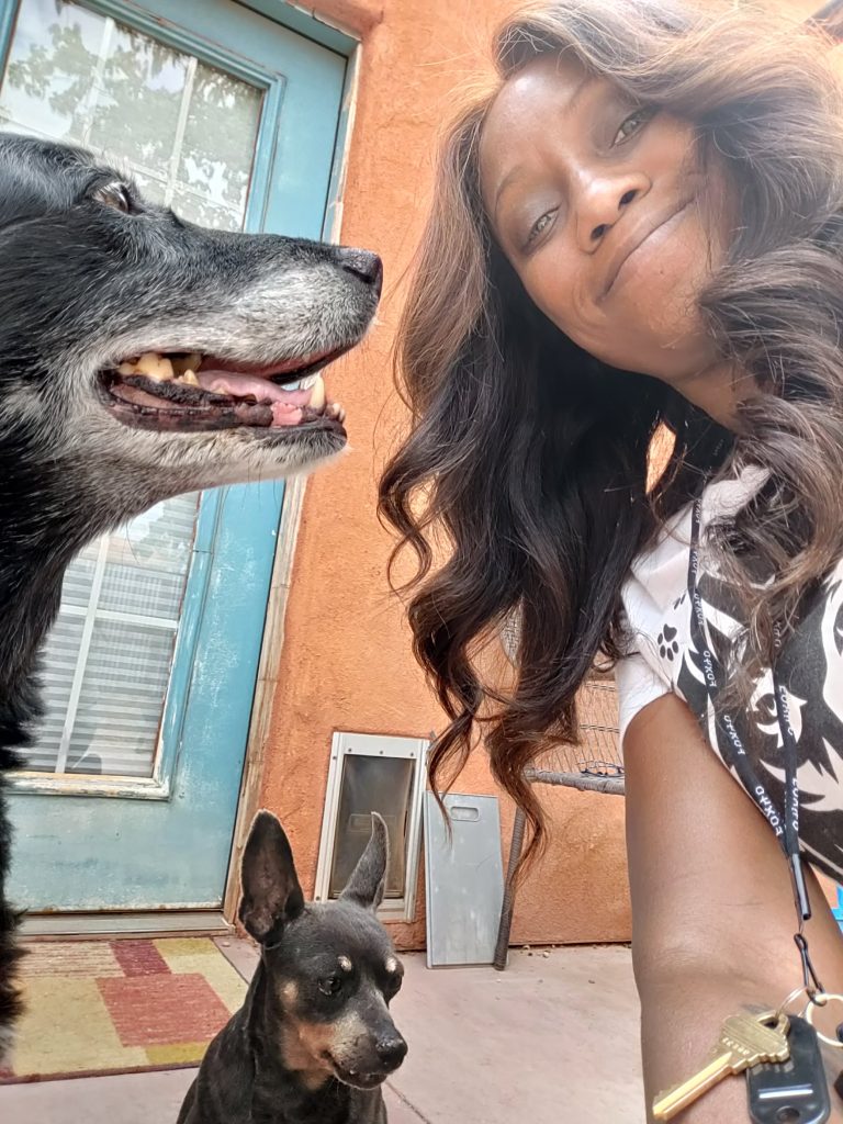 Phae Sunday poses with two dogs she takes care of through Phae's Pack, location and date unspecified | Photo courtesy of Phae Sunday, St. George News