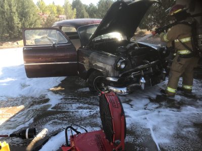 Fire crew extinguish a car fire in Dammeron Valley on Oct. 29, 2022 | Photo via the Dammeron Valley Fire & Rescue Facebook page.