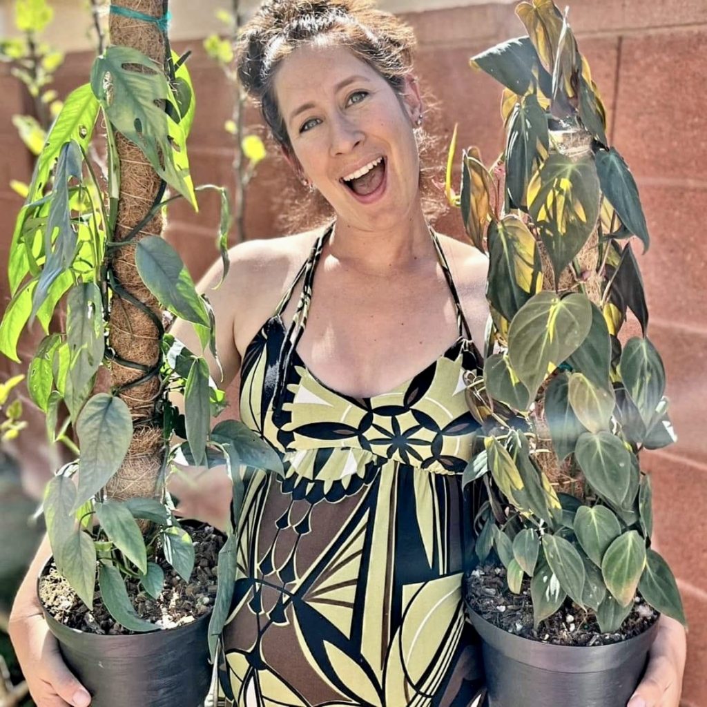 Kayla Kline poses with her plants, location and date unknown | Photo courtesy of Kayla Kline, St. Louis.george news