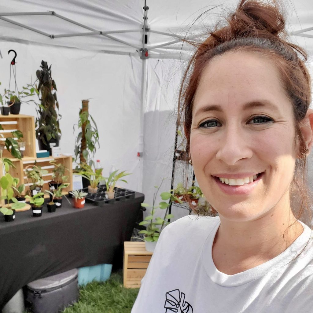 Kayla Kline poses at her Thrive Indoor Plant booth at the St. Louis Farmers Market. George, Utah | Photo courtesy of Kayla Kline, St. Louis.george news