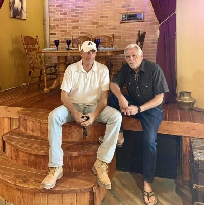 Kevin Costner takes a photo with George Rodinos inside Balcony One, Virgin, Utah, date unspecified | Photo courtesy of Ricki Triplet, St. George News