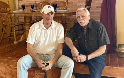 Kevin Costner takes a photo with George Rodinos inside Balcony One, Virgin, Utah, date unspecified | Photo courtesy of Ricki Triplet, St. George News