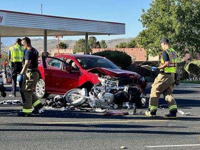 A car sits in the roadway next to a smashed motorcycle after the vehicles collide, St. George, Utah , Oct. 19, 2022 | Photo by Jessi Bang, St. George News