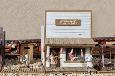 A butcher shop within the Saunders' outdoor train display includes a ceramic butcher made by Laurie Saunders, Washington City, Utah, Nov. 1, 2022 | Photo by Jessi Bang, St. George News