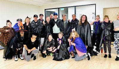 Attendees of Shelley Larsen's Zumba class pose for a photo during a themed night, location and date unspecified | Photo courtesy of Shelley Larsen, St. George News