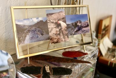 A photo collage of Mack's late grandfather sits framed on a desk inside the Dazed and Topazed jewelry studio, St. George, Utah, Jan. 15, 2023 | Photo by Jessi Bang, St. George News