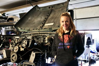 Rubi Kunsch takes a photo next to her Jeep build, which she will use to race the King of the Hammers race, St. George, Utah, Jan. 22, 2023 | Photo by Jessi Bang, St. George News