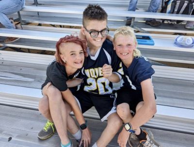 Corbin Kirkham takes a photo with his siblings Estella and Duke Bracken, location and date unspecified | Photo courtesy of Stacy Mitchell, St. George News