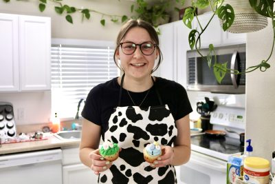 Desert Flower Sweet's owner Becky Condie takes a photo with her cupcakes in St. George, Utah, March 27, 2023 | Photo by Jessi Bang, St. George News