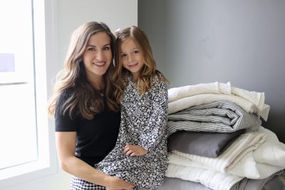 Jacque Colemere, the owner of Make It Blanket, takes a photo with her daughter and products from her company line, St. George, Utah, May 4, 2023 | Photo by Jessi Bang, St. George News