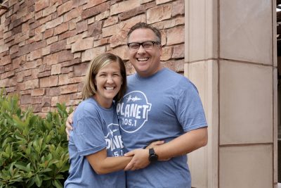 Husband and wife Mikey and Bonnie Foley take a photo together outside their new radio home at Canyon Media in St. George, Utah, May 25, 2023 | Photo by Jessi Bang, St. George News