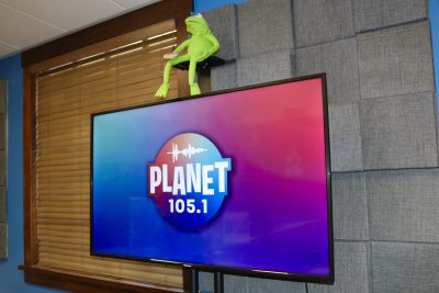 A screen shows the logo for Planet 105.1 inside Canyon Media in St. George, Utah, May 31, 2023 | Photo by Jessi Bang, St. George News