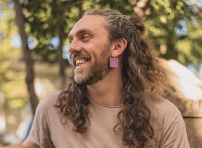 A male model sports earrings by WOMIN Studio, an all-inclusive brand, location and date unspecified | Photo courtesy of Diana Smith, St. George News