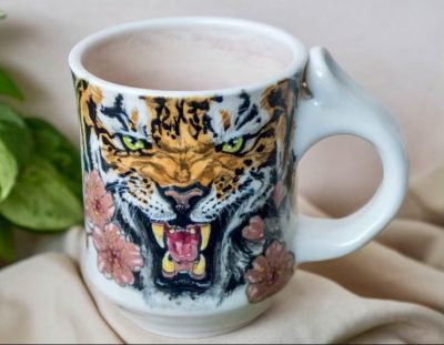 A handmade ceramic mug by Kelsey Wheeler features a hand-drawn tiger scene, location and date unspecified | Photo courtesy of Kelsey Wheeler, St. George News