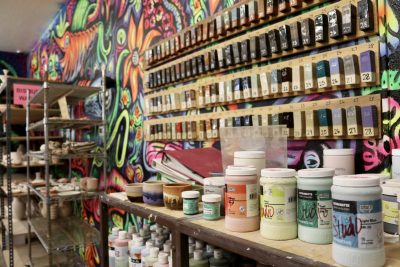The studio inside The Tilted Kiln features a painted art wall and supplies in St. George, Utah, Oct. 5, 2023 | Photo by Jessi Bang, St. George News