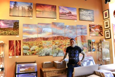 Artist Charly Moore stands inside Mystic Canyon Light Gallery, a studio in the Kayenta Art Village that features his photography and other mediums of art, Ivins, Utah, Nov. 13, 2023 | Photo by Jessi Bang, St. George News