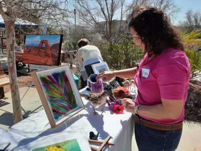 An artist showcases her work at Art in the Courtyard, which takes place outside of Red Cliff Gallery in St. George, Utah, circa 2023 | Photo courtesy of Jo Ann Merrill, St. George News