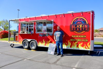 Blazin Hearth Mobile Wood Fired Kitchen owner Kendall Pipkin stands in front of his trailer at Sunbrook Golf Course in St. George, Utah, April 9, 2024 | photo by Jessi Bang, St. George News