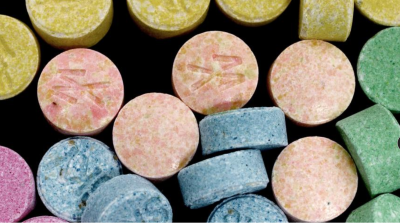 Stock image of MDMA tablets, also known as ecstasy is a stimulant and a hallucinogen } Photo courtesy of the Drug Enforcement Agency, St. George News 